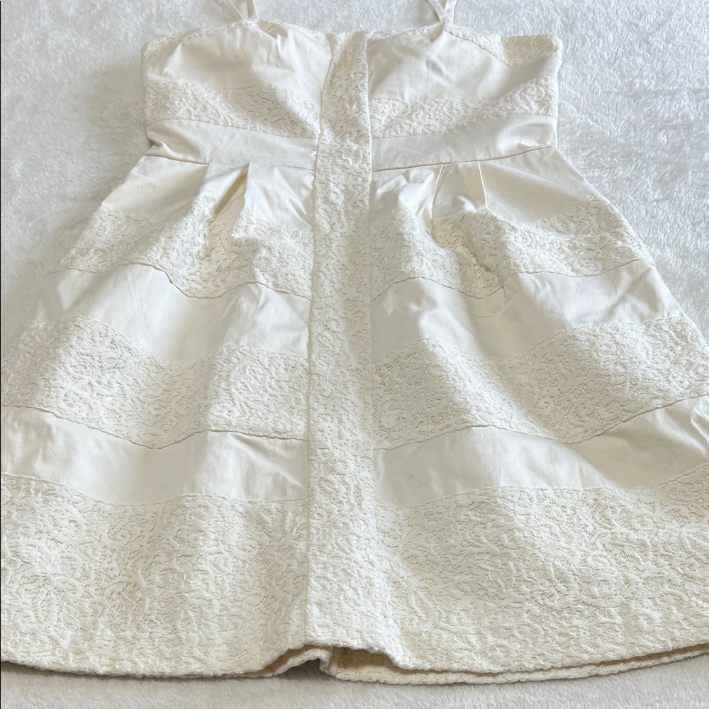 Ivory Strapless Mini Dress with Tiered Lace Panels and Pleated Skirt Size 10
